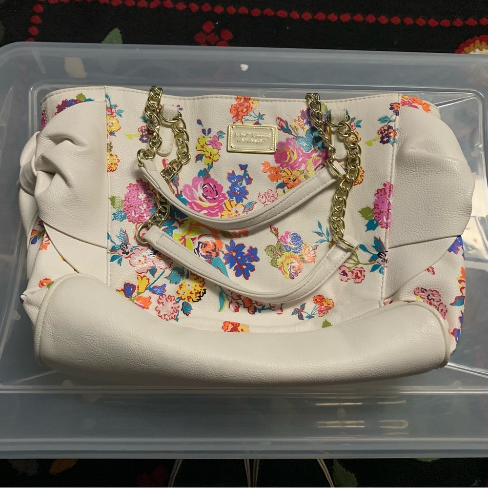 White floral print Betsey Johnson purse.